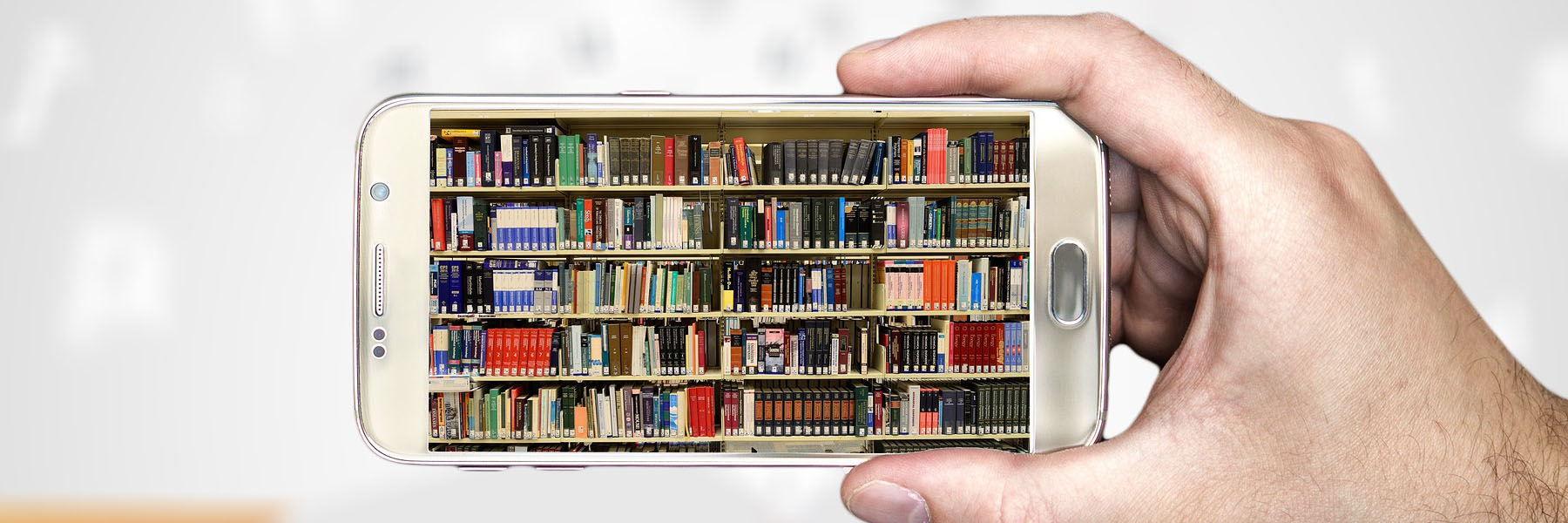 A picture of a bookshelf on a phone.